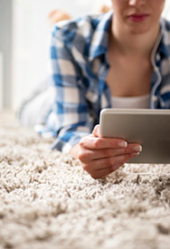 Woman using tablet computer